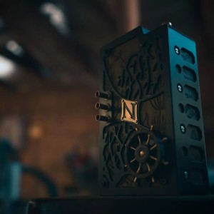 A beautiful black puzzle box  with a ship's wheel
